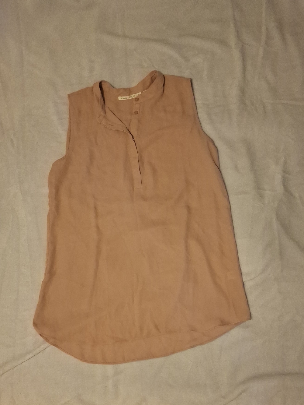 On Sale 3 Lady's sleeveless top for one price.